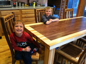 Photo shows Eli's beautiful "double border" tabletop design and Johnny's exceptionally beautiful chair designs.